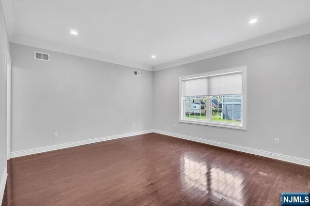 a picture of a bench in front of a wall