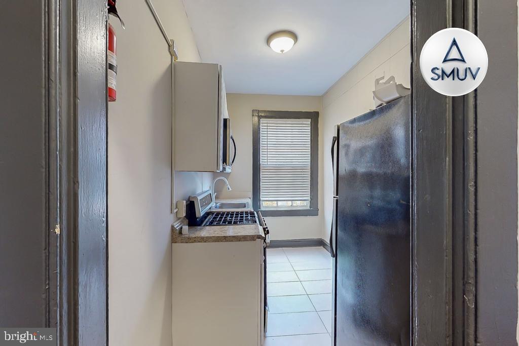 24 East Madison Street, Unit EF Baltimore, MD 21202 - Photo 15 of 23 a view of a hallway with elevator