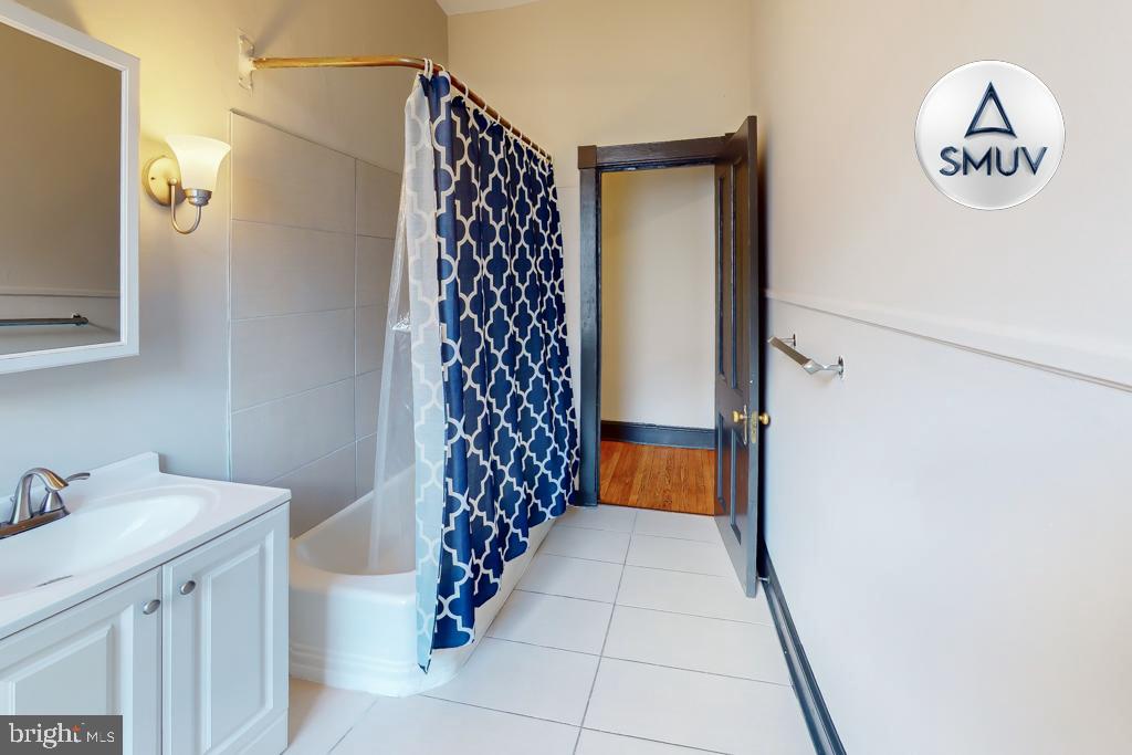 24 East Madison Street, Unit EF Baltimore, MD 21202 - Photo 18 of 23 a bathroom with a shower and a sink