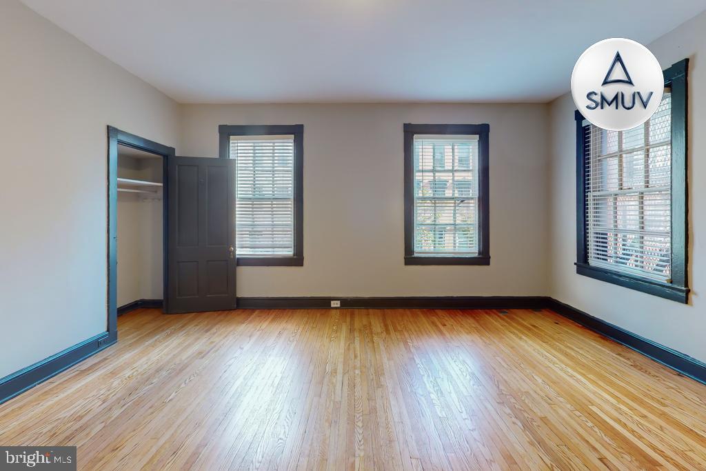 24 East Madison Street, Unit EF Baltimore, MD 21202 - Photo 2 of 23 a view of room with wooden floor