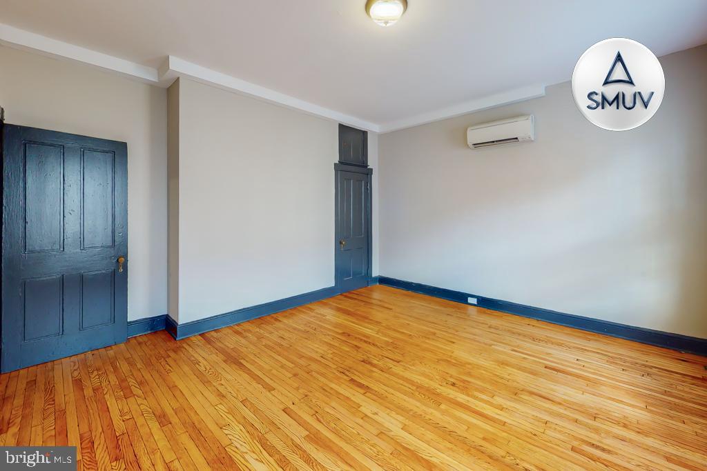 24 East Madison Street, Unit EF Baltimore, MD 21202 - Photo 3 of 23 a view of empty room with wooden floor