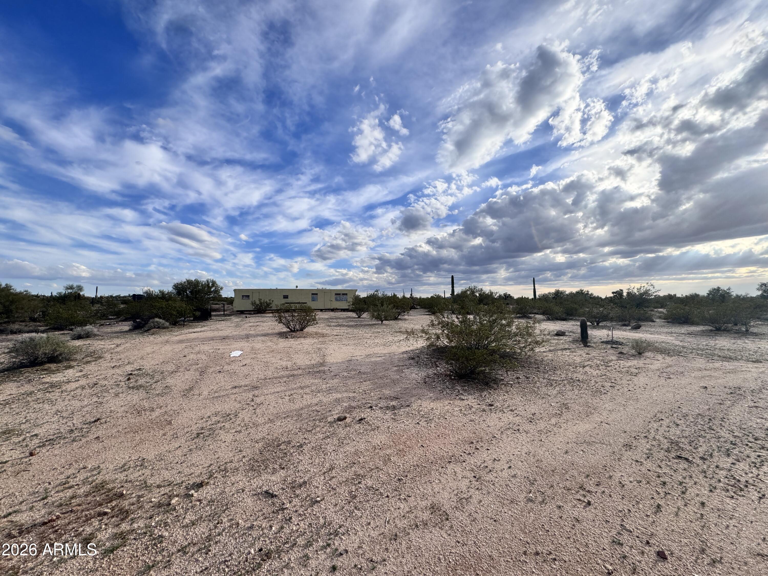 14438 North Reed Road Florence, AZ 85132 - Photo 16 of 28 a view of a dry yard with wooden fence