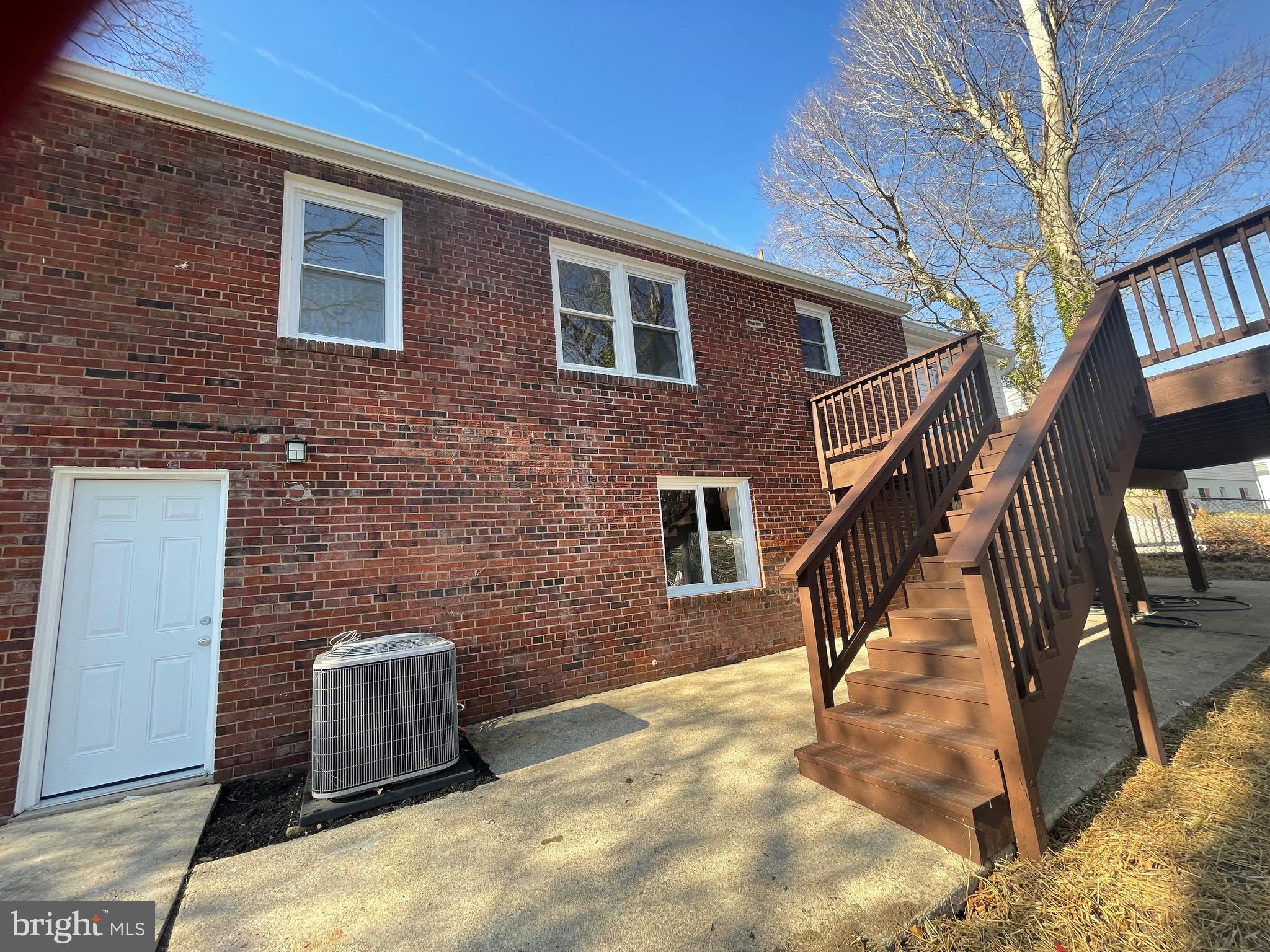 6107 Buckler Road Clinton, MD 20735 - Photo 1 of 45 a brick building with a sink and stairs
