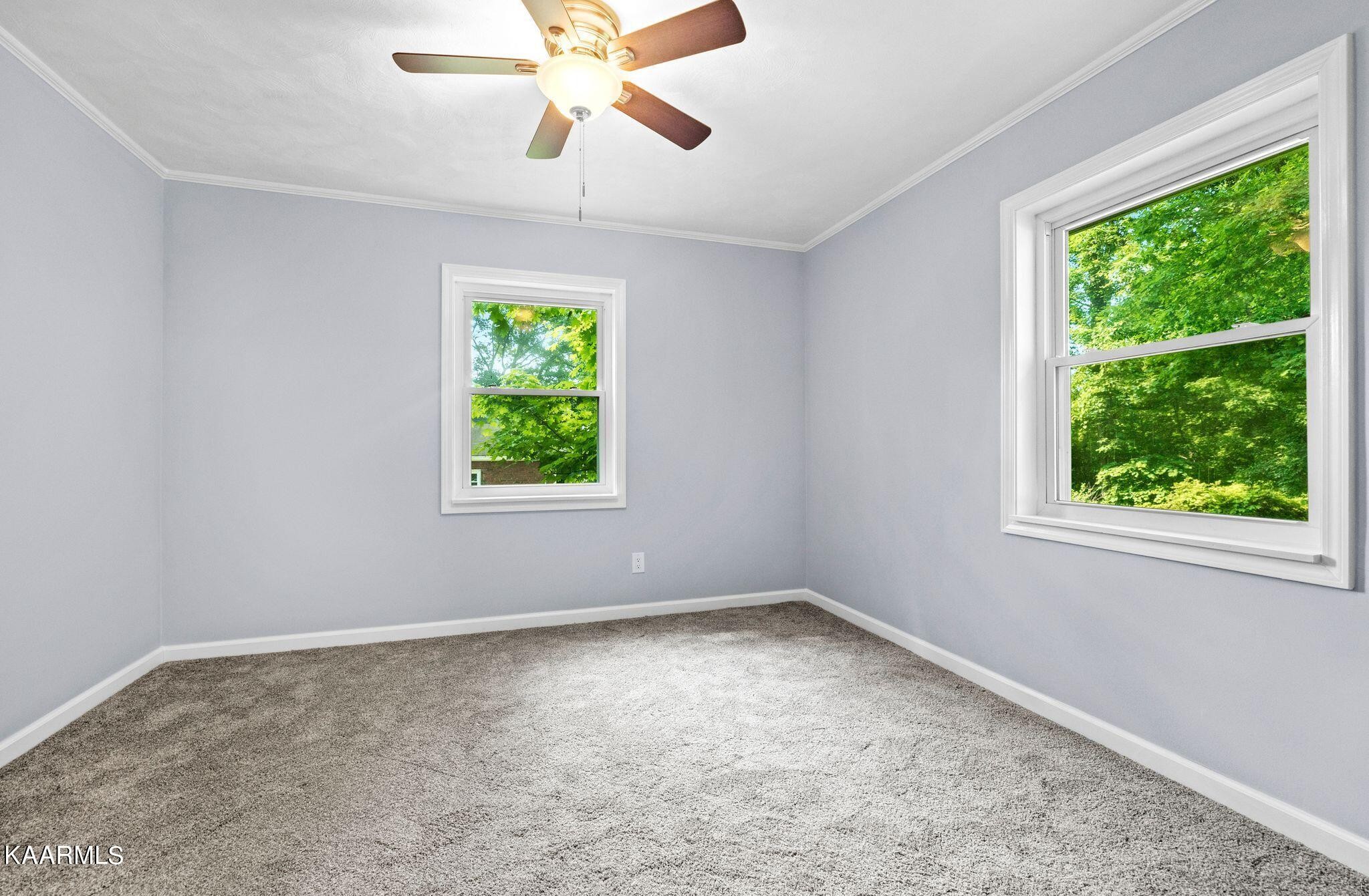 107 Forest Circle Powell, TN 37849 - Photo 6 of 14 a view of room with window and ceiling fan