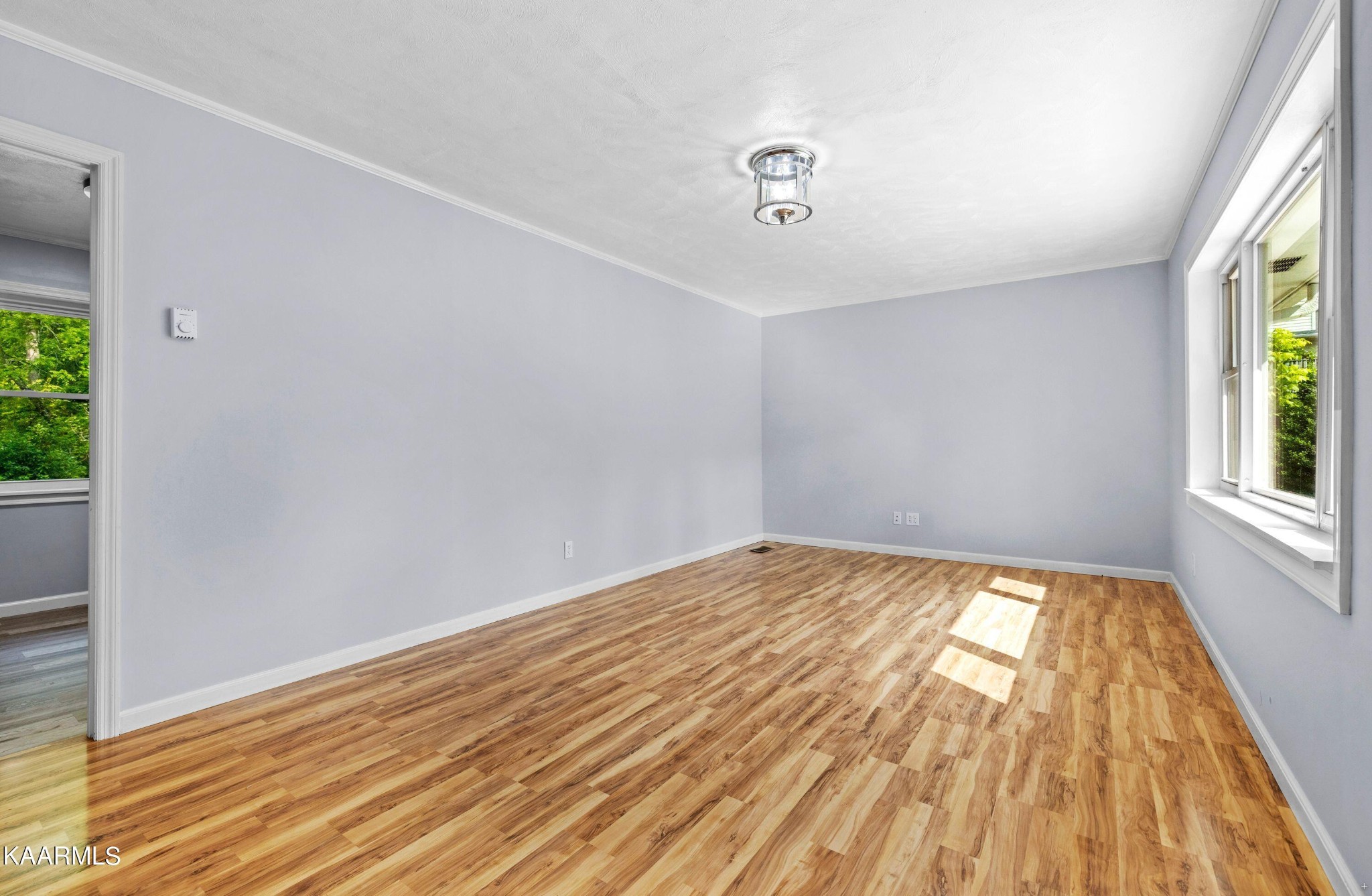 107 Forest Circle Powell, TN 37849 - Photo 10 of 14 wooden floor in an empty room with a window