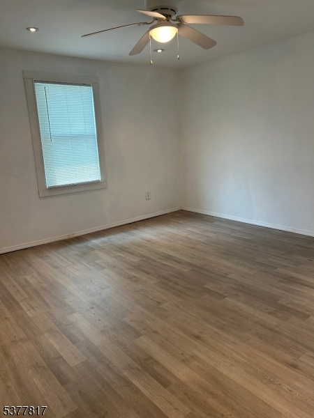 1776 North Tuckahoe Road Williamstown, NJ 08094 - Photo 8 of 16 an empty room with wooden floor and windows