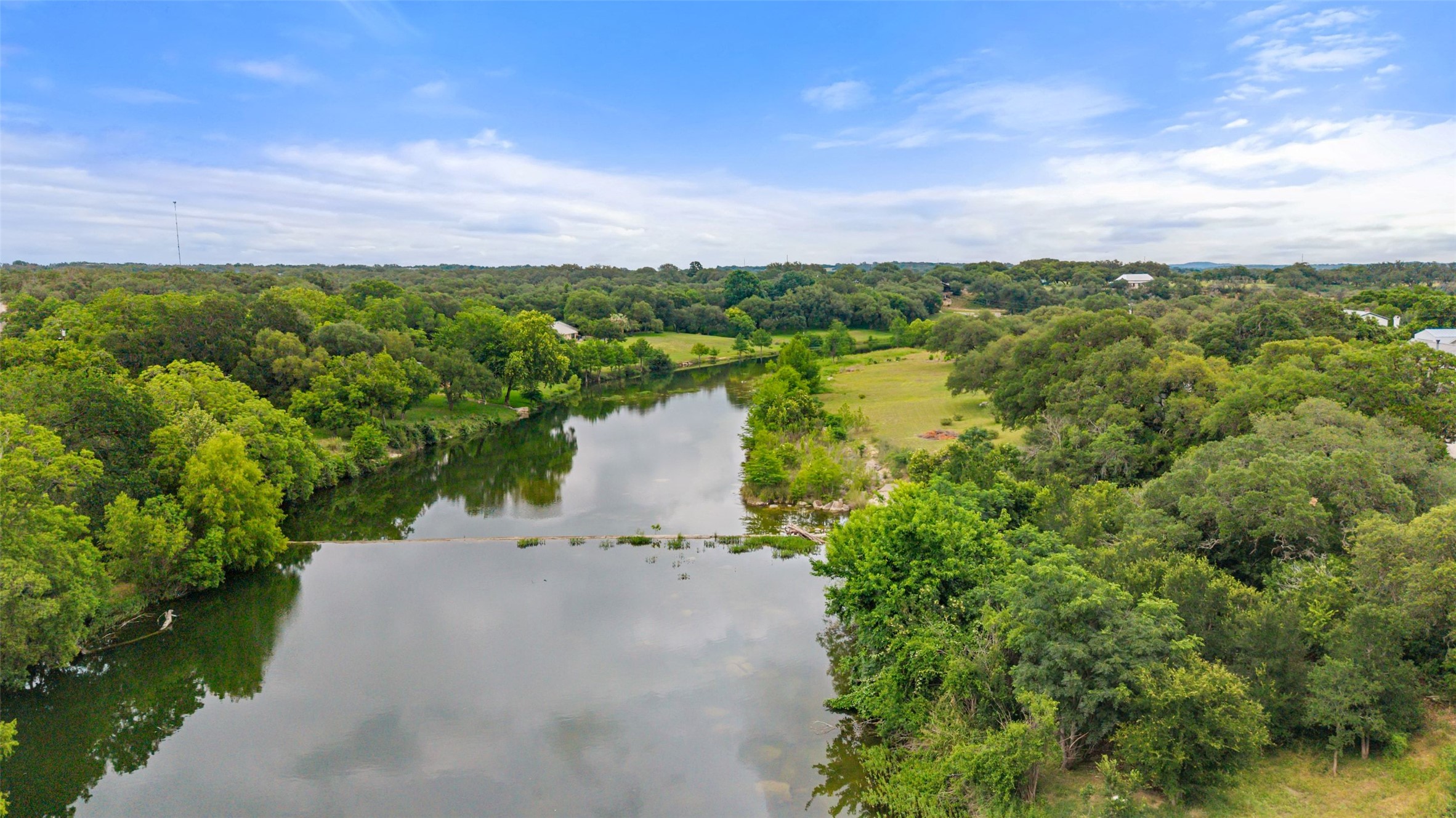 701 River Road Blanco, TX 78606 - Photo 36 of 38 a view of a lake with houses in back