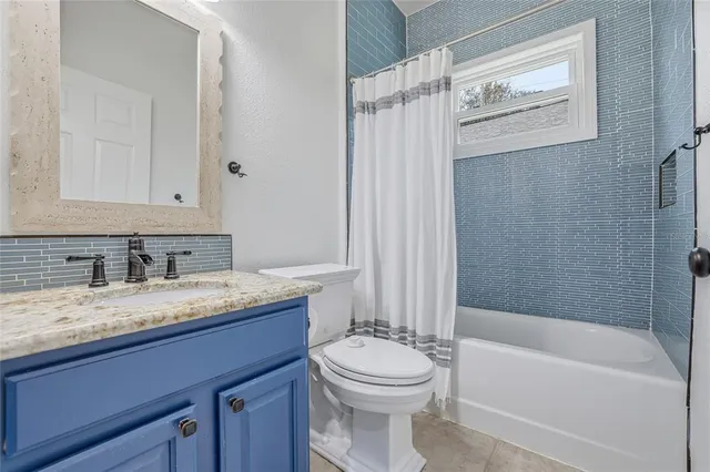 an aerial view of a house with a garden