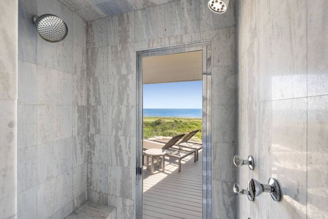 a bathroom with a glass shower door