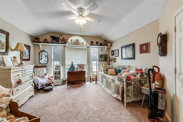a view of a livingroom with furniture and toys