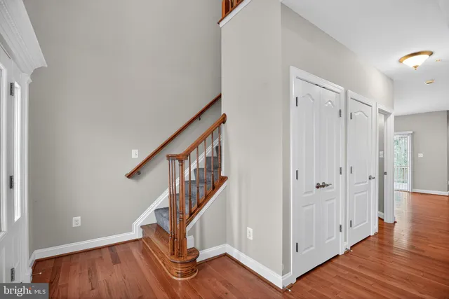 a view of an entryway with wooden floor