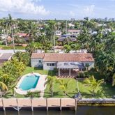 a view of a chairs and table in patio