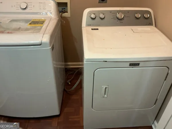 a utility room with dryer and washer
