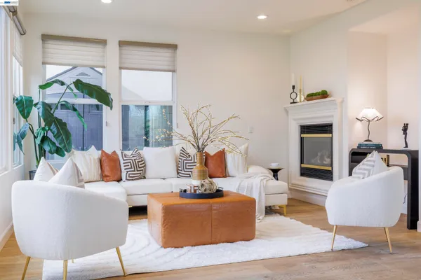 a view of a dining room with furniture and a potted plant