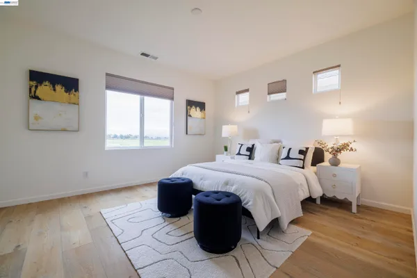 a bedroom with a bed and a window in it