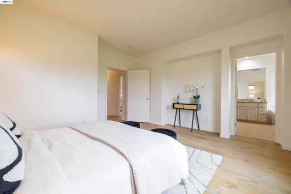 a living room with a couch a rug and a wooden floor