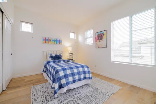 a bathroom with a sink double vanity mirror and a bathtub