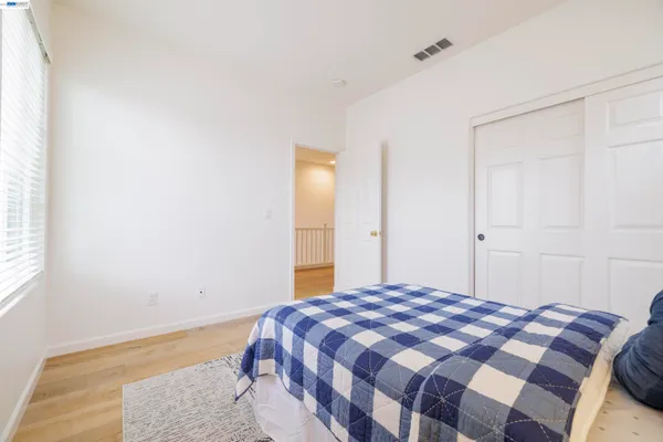 a bathroom with a granite countertop sink mirror and a bathtub