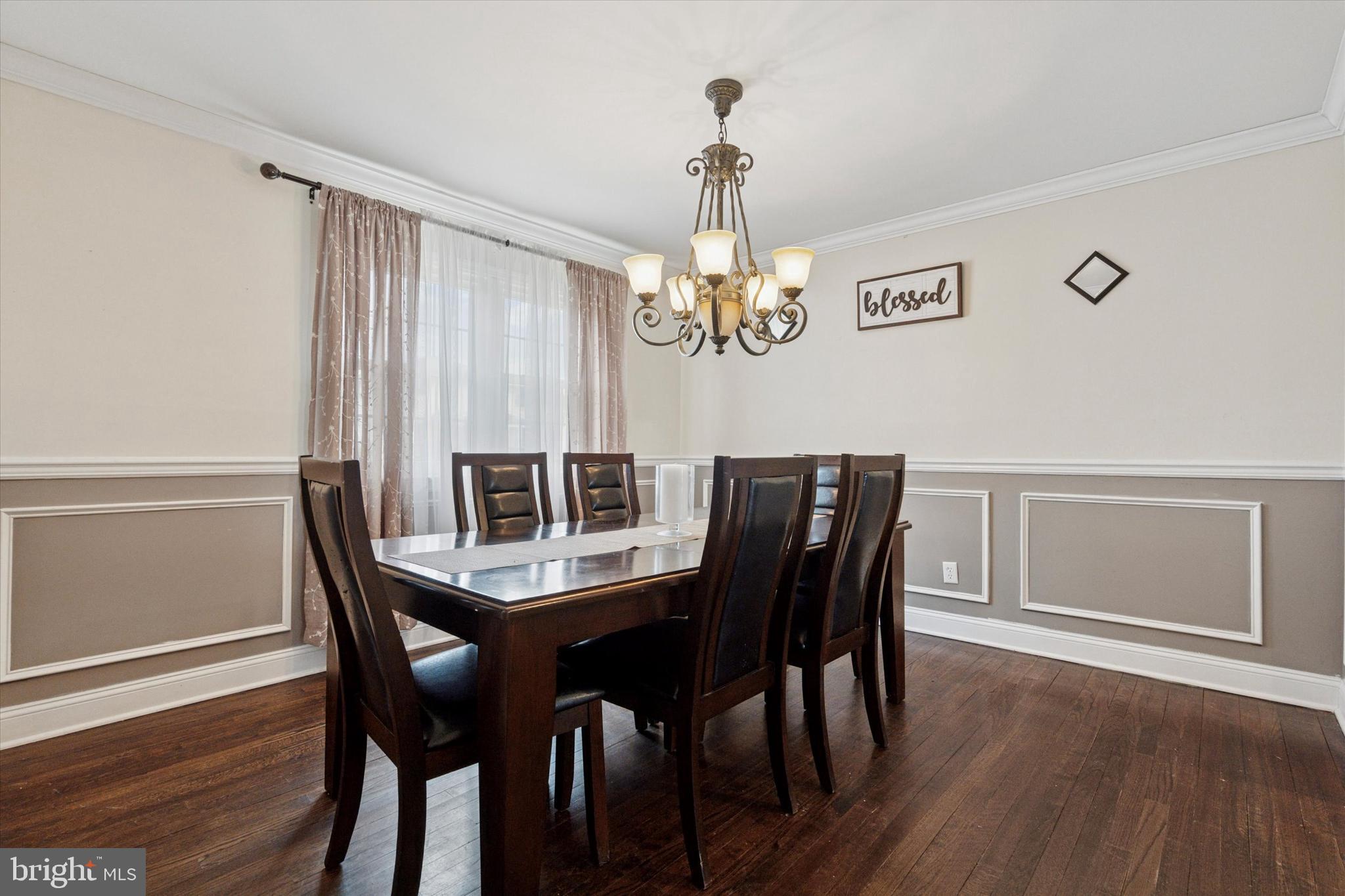 2310 Klockner Road Hamilton, NJ 08690 - Photo 13 of 33 a view of a dining room with furniture wooden floor and chandelier