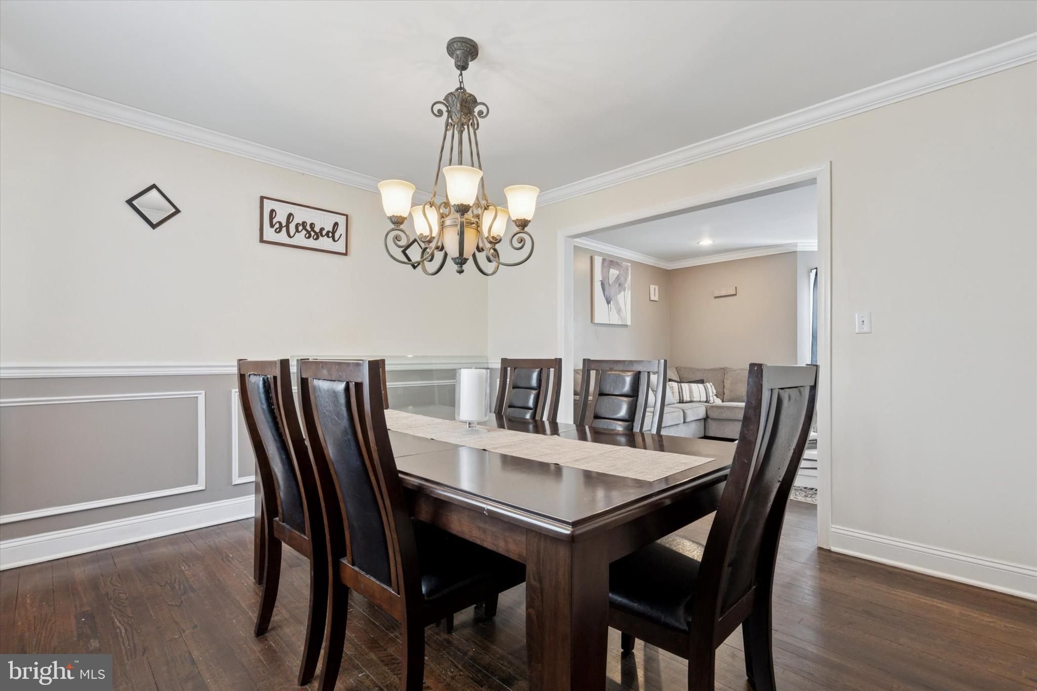 2310 Klockner Road Hamilton, NJ 08690 - Photo 14 of 33 a view of a dining room with furniture a chandelier and wooden floor
