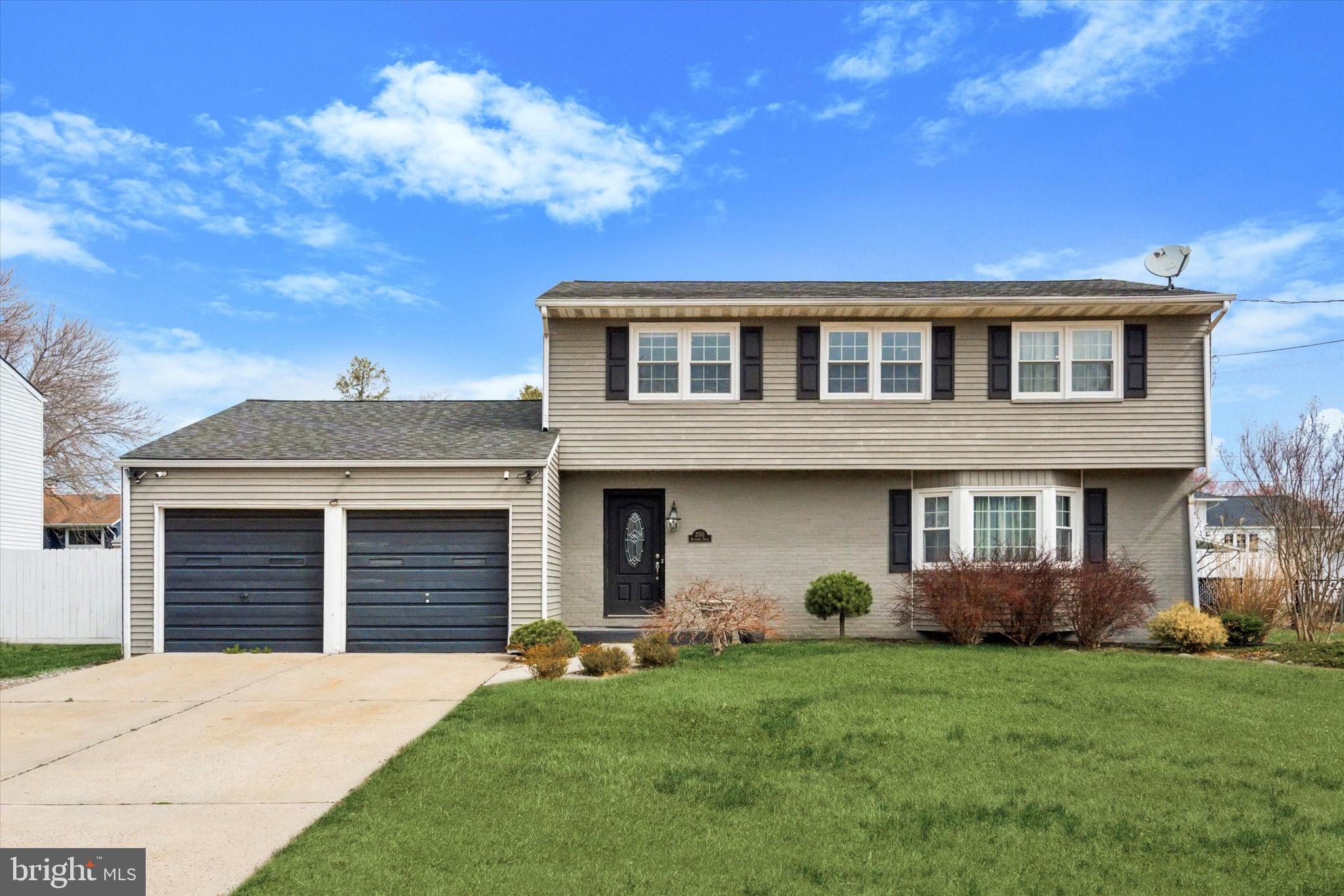2310 Klockner Road Hamilton, NJ 08690 - Photo 2 of 33 a front view of a house with garden