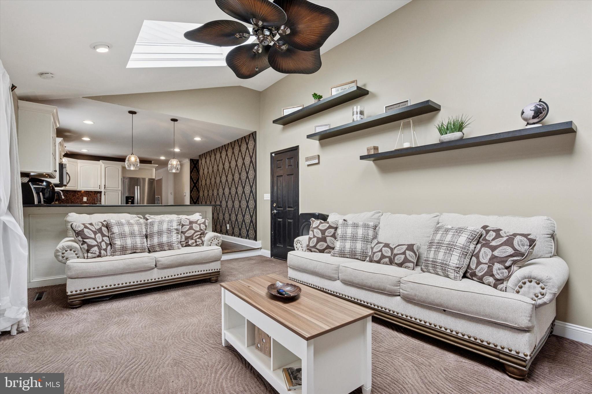 2310 Klockner Road Hamilton, NJ 08690 - Photo 23 of 33 a living room with furniture kitchen view and a chandelier