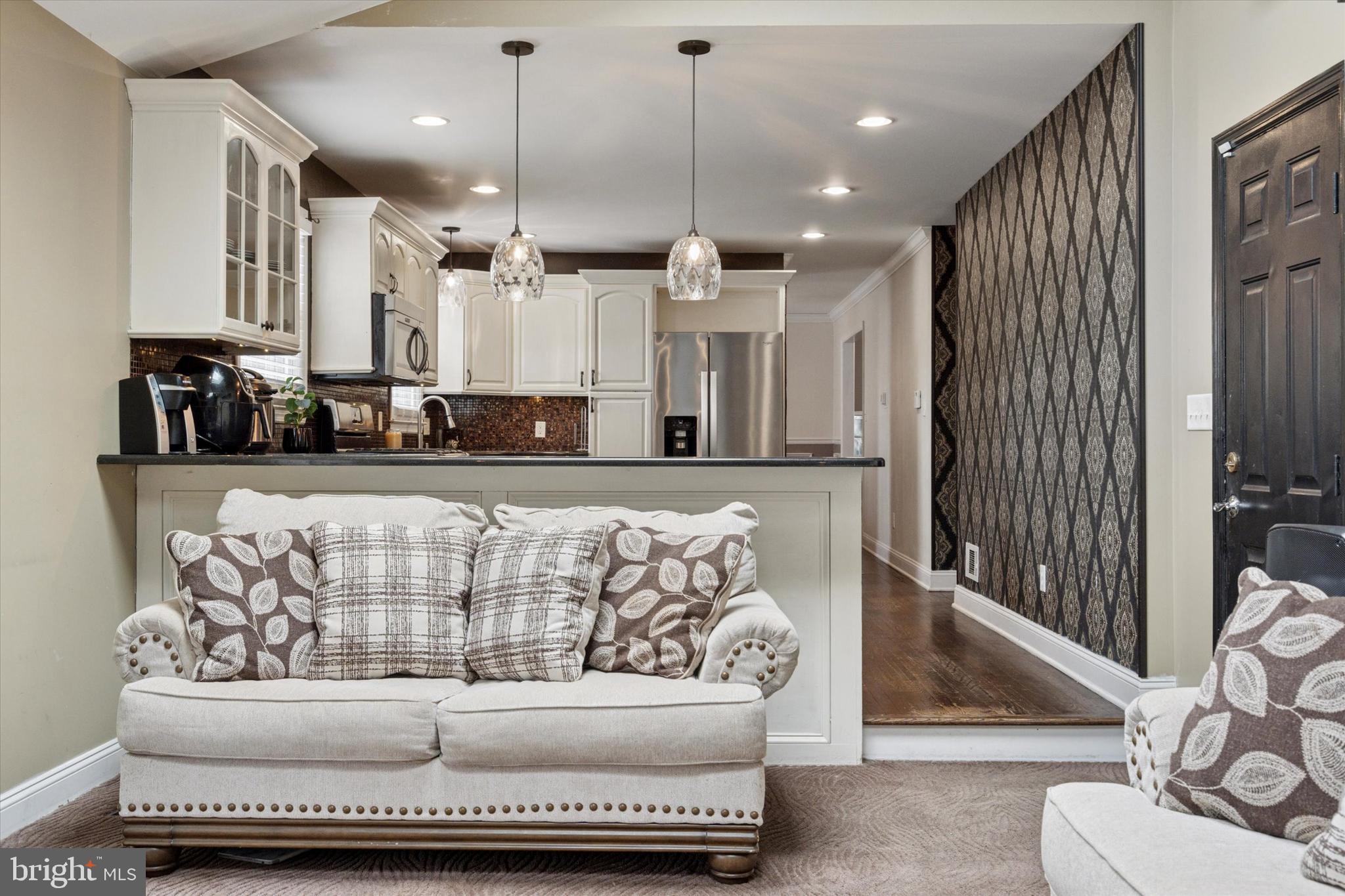 2310 Klockner Road Hamilton, NJ 08690 - Photo 25 of 33 a living room with furniture and kitchen view