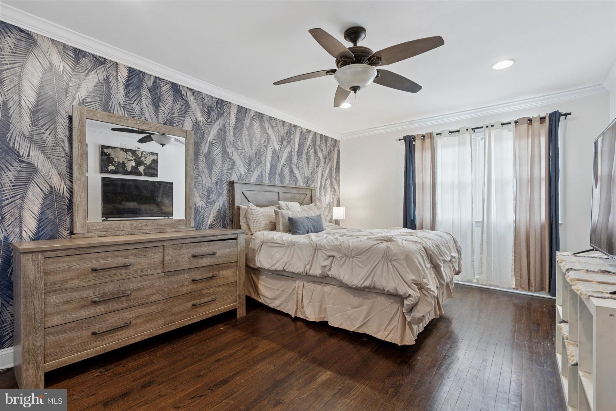 2310 Klockner Road Hamilton, NJ 08690 - Photo 26 of 33 a bedroom with a large bed chandelier and a window