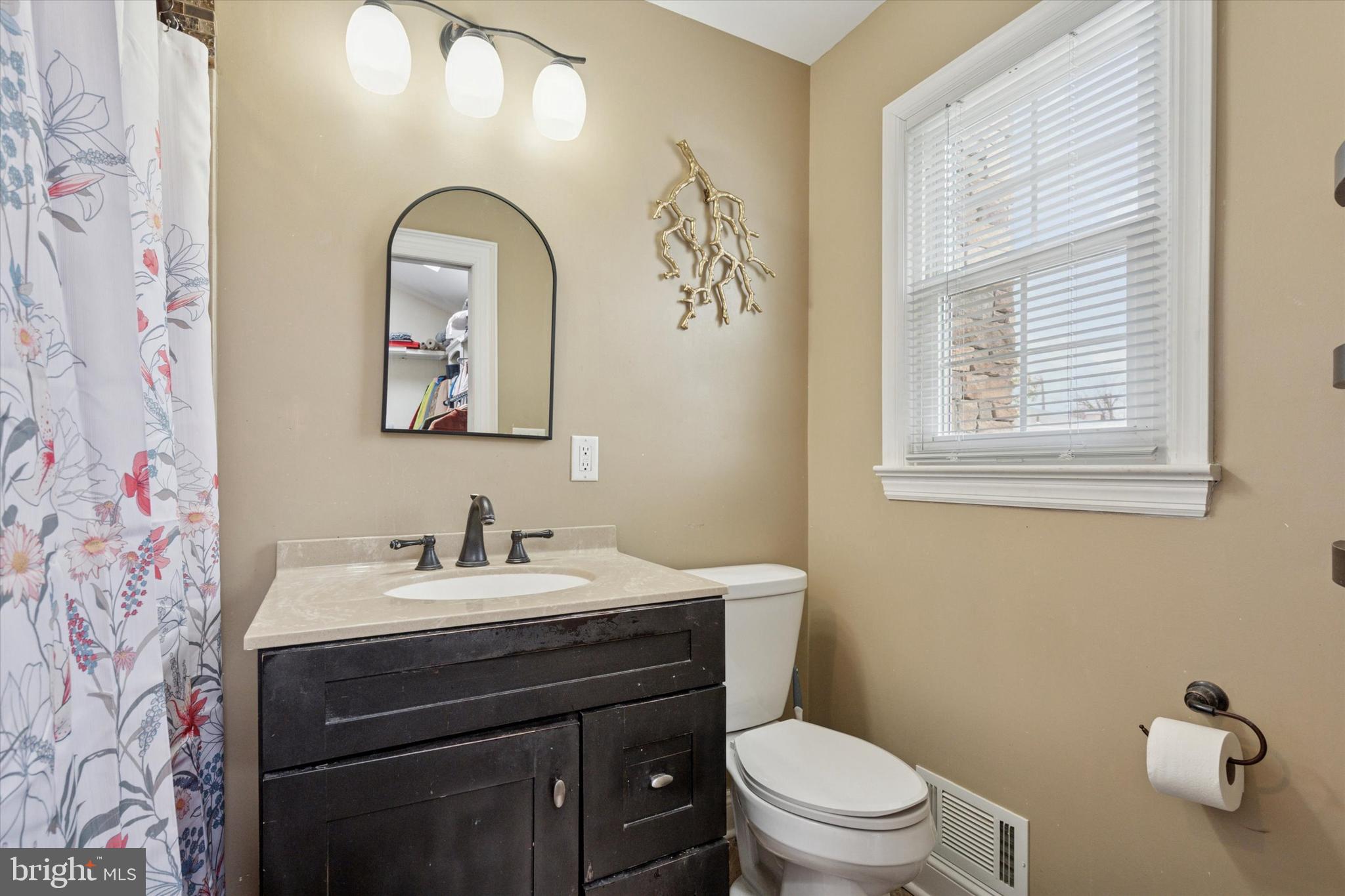 2310 Klockner Road Hamilton, NJ 08690 - Photo 28 of 33 a bathroom with a sink a toilet and a window