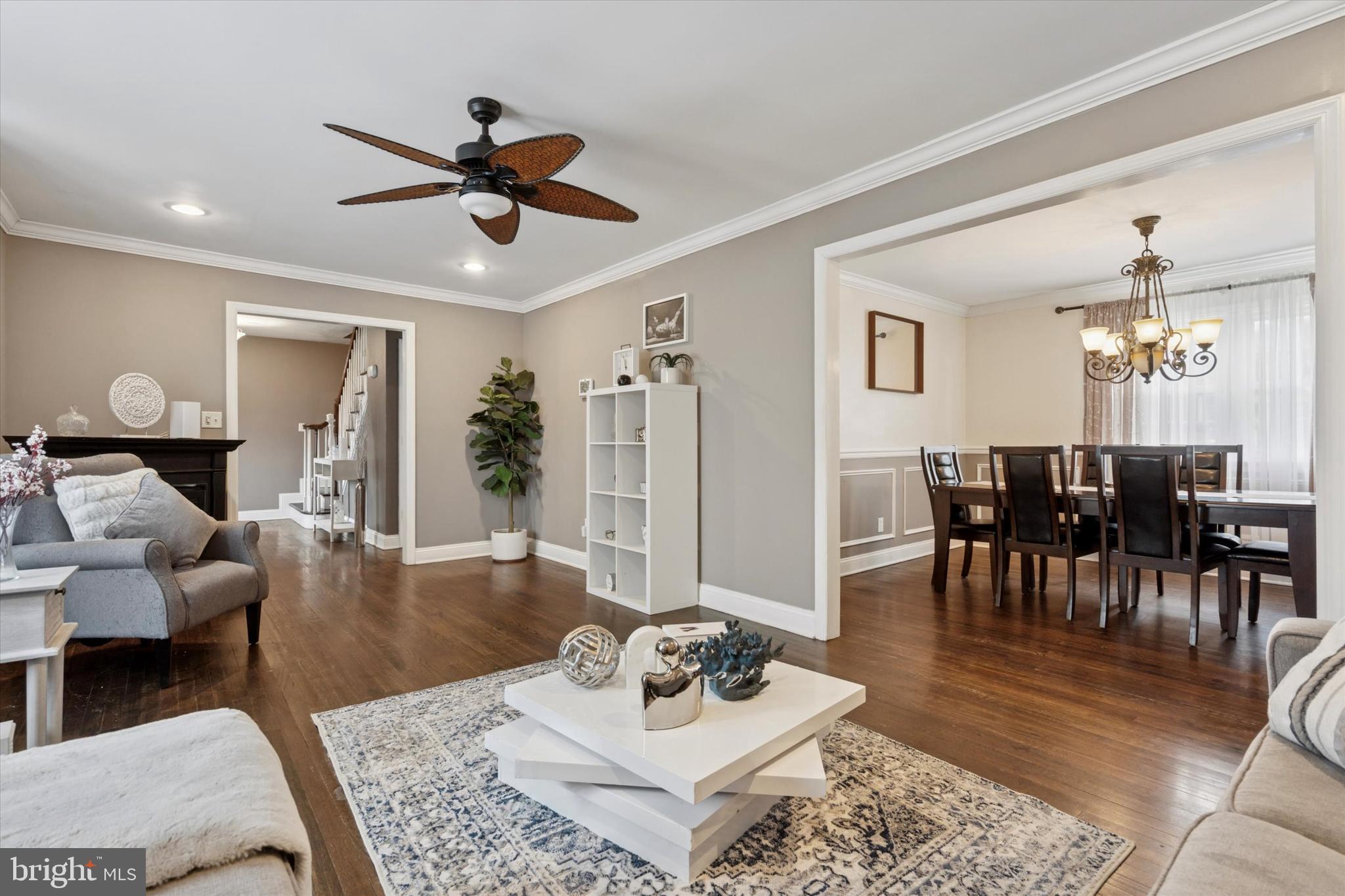 2310 Klockner Road Hamilton, NJ 08690 - Photo 9 of 33 a living room with furniture a rug and a chandelier