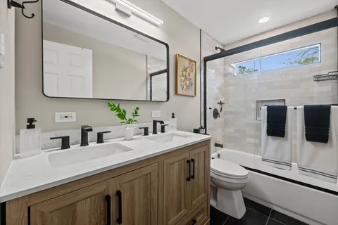 a bathroom with a sink and mirror