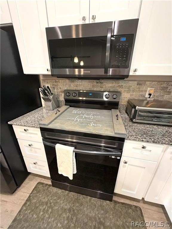 13591 Southwest 112th Street Dunnellon, FL 34432 - Photo 4 of 24 a close view of stove