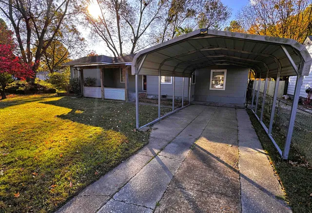 a view of backyard with large trees