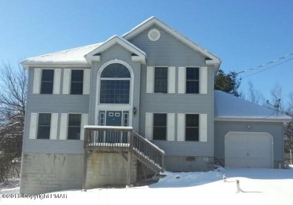 1485 Clover Road Long Pond, PA 18334 - Photo 1 of 23 a front view of a house with large windows