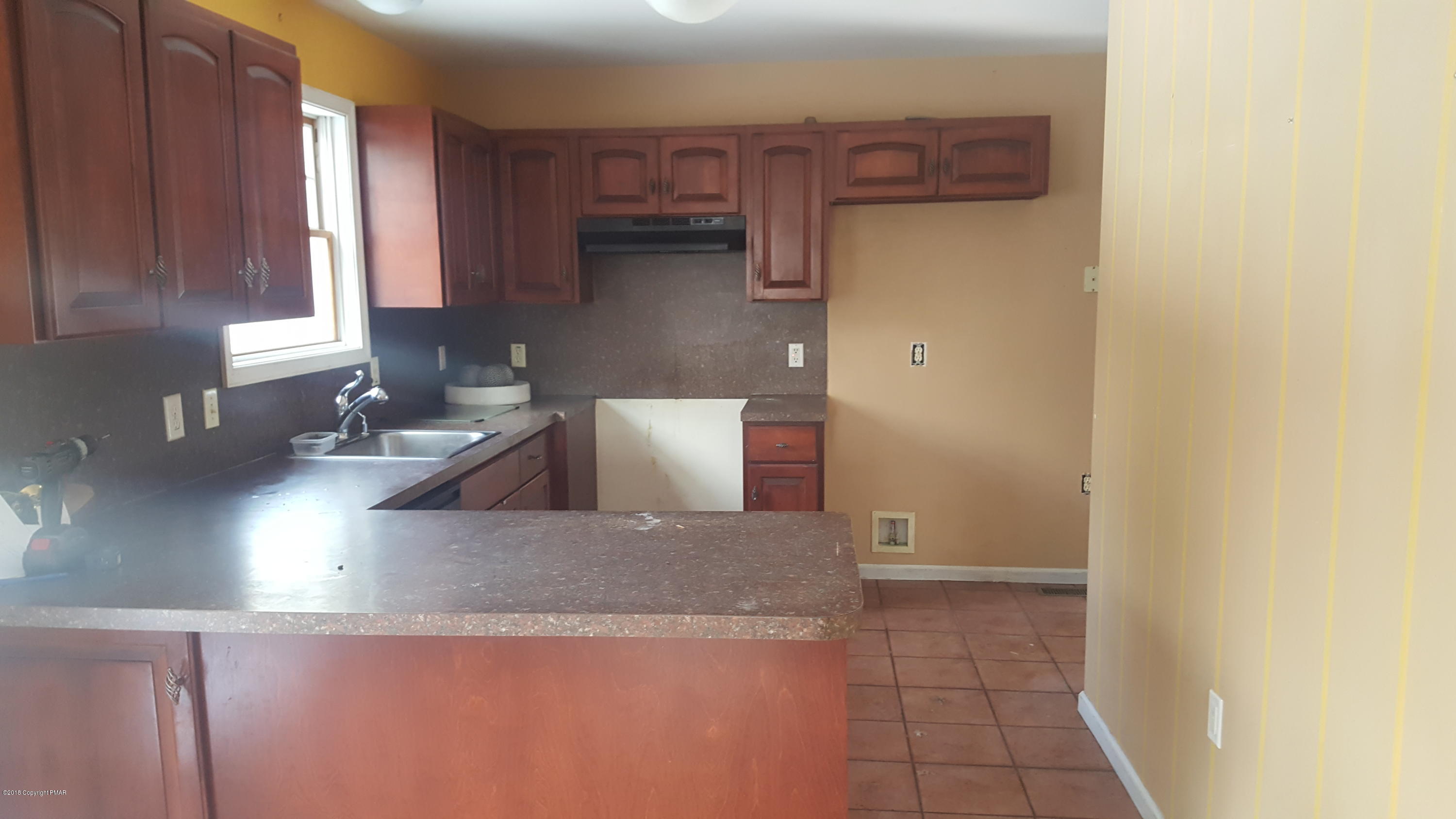 1485 Clover Road Long Pond, PA 18334 - Photo 3 of 23 a kitchen with stainless steel appliances granite countertop a sink and a stove