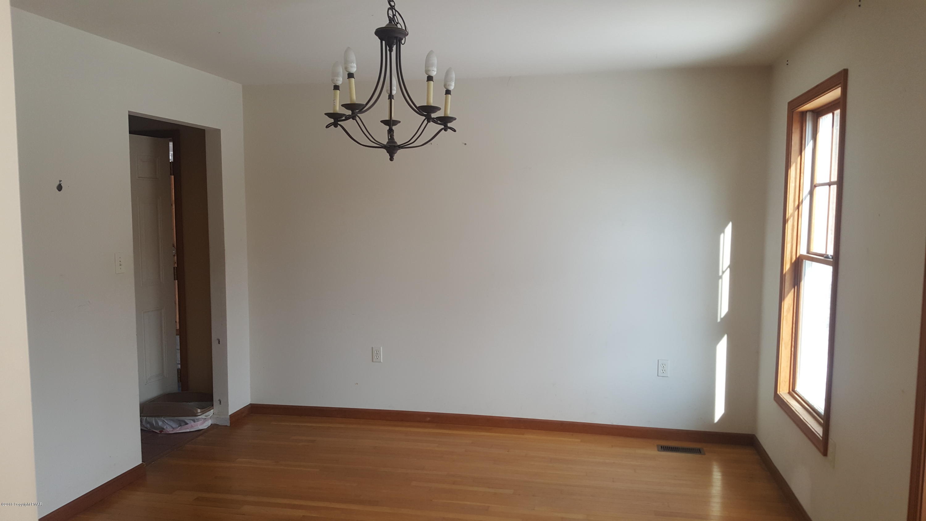 1485 Clover Road Long Pond, PA 18334 - Photo 4 of 23 a view of a room with wooden floor and windows