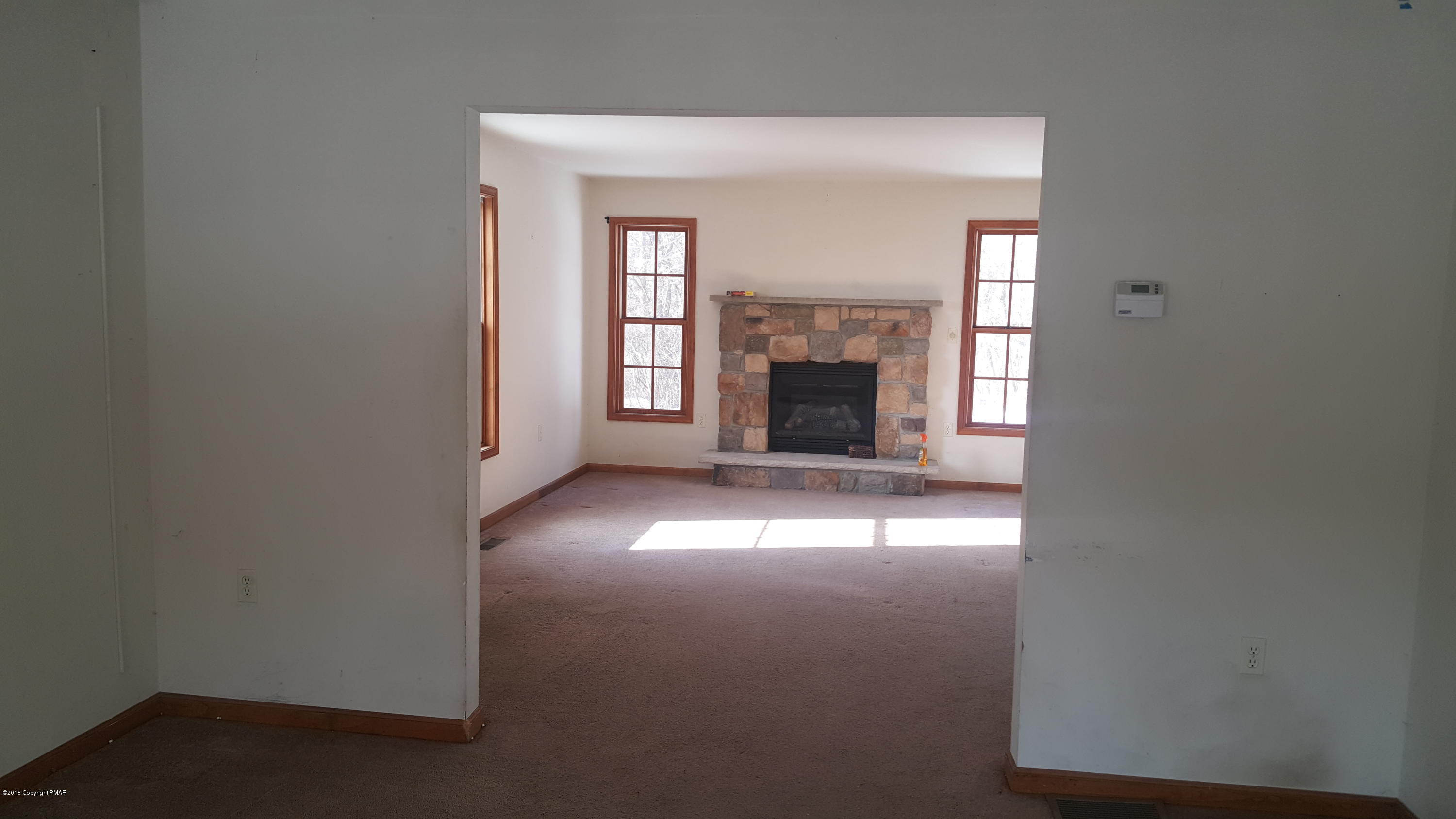 1485 Clover Road Long Pond, PA 18334 - Photo 6 of 23 a view of empty room with a fireplace