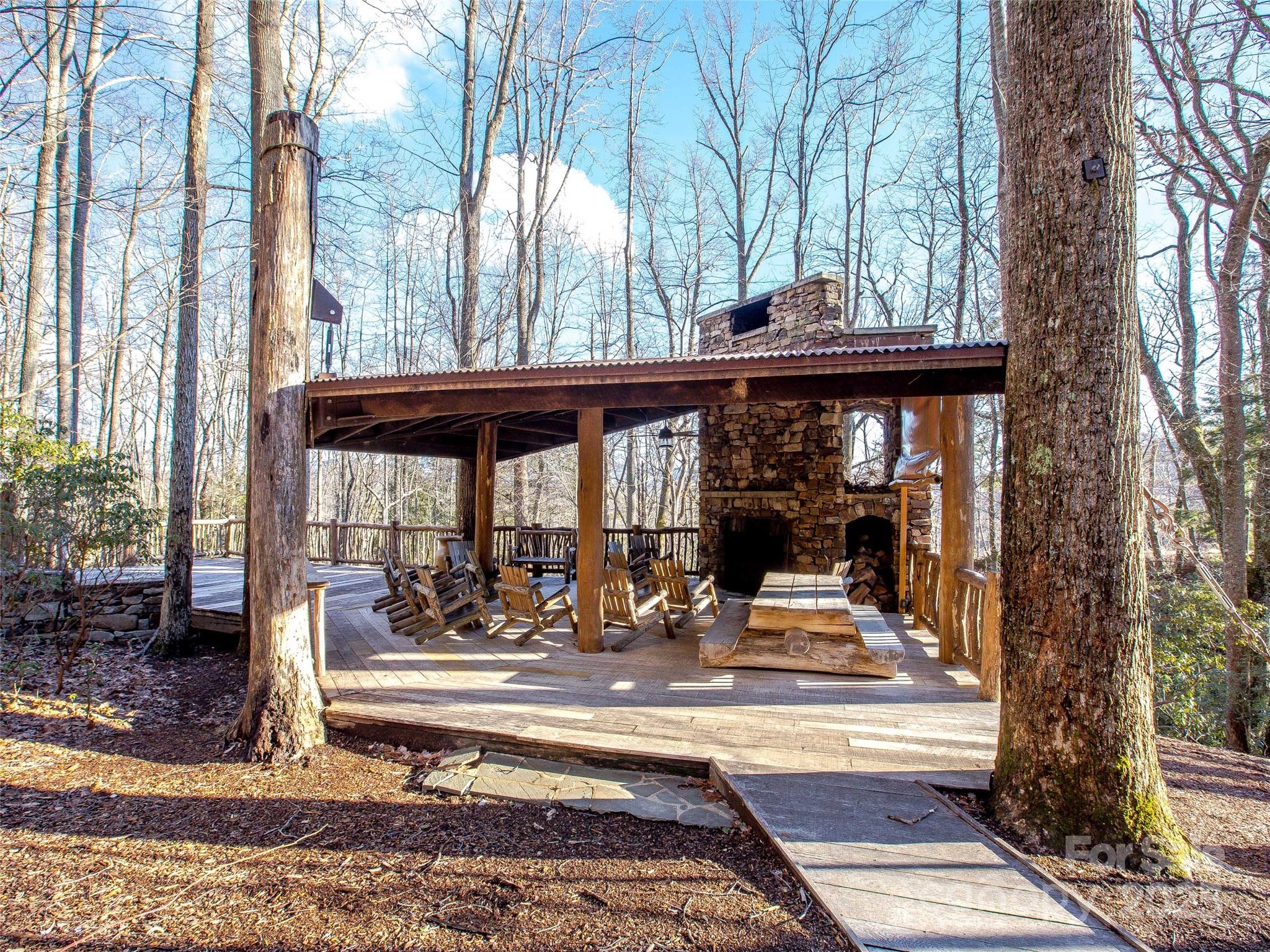 36 Slide Rock Way Fairview, NC 28730 - Photo 15 of 24 a view of a building with a bench in front of it