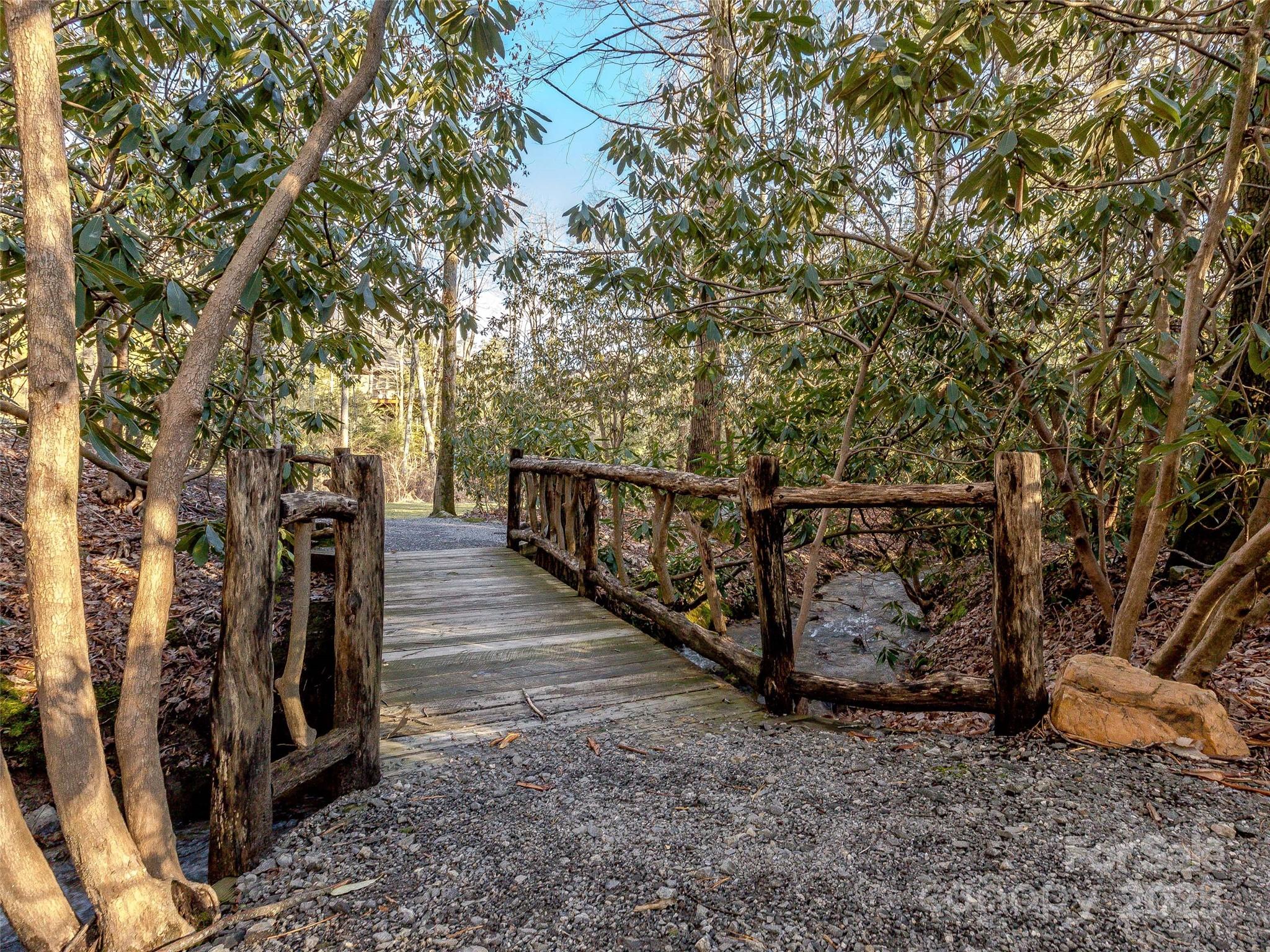 36 Slide Rock Way Fairview, NC 28730 - Photo 17 of 24 a view of a pathway with a wrought fence