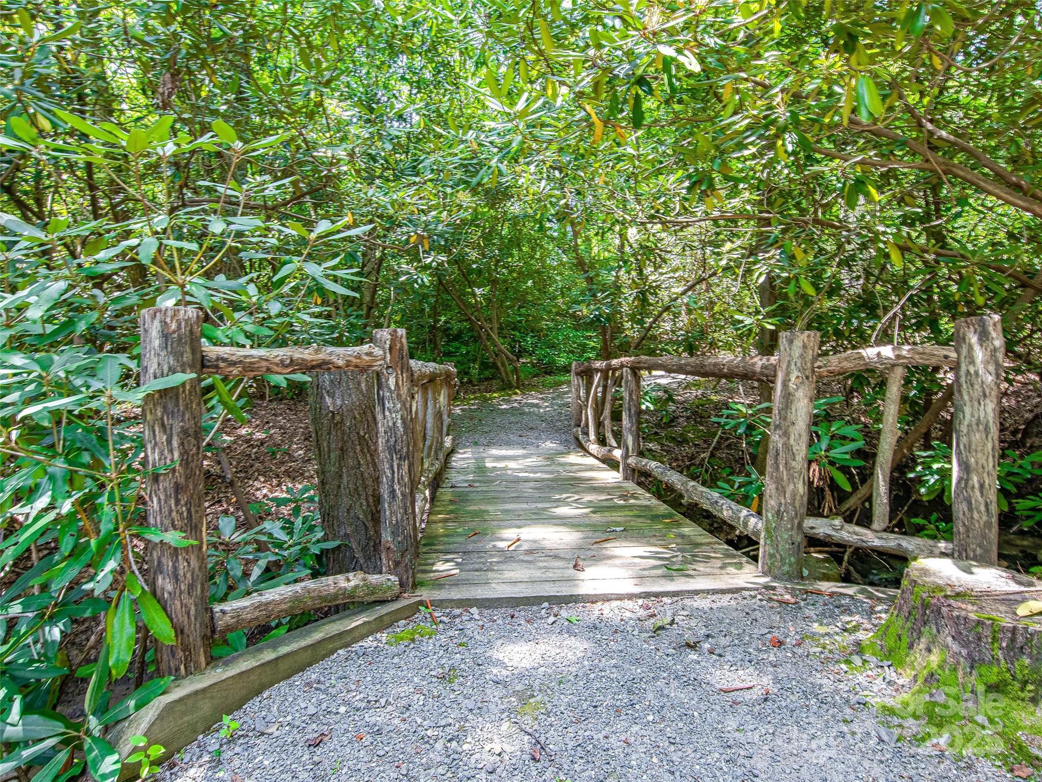 36 Slide Rock Way Fairview, NC 28730 - Photo 23 of 24 a view of a backyard with wooden fence