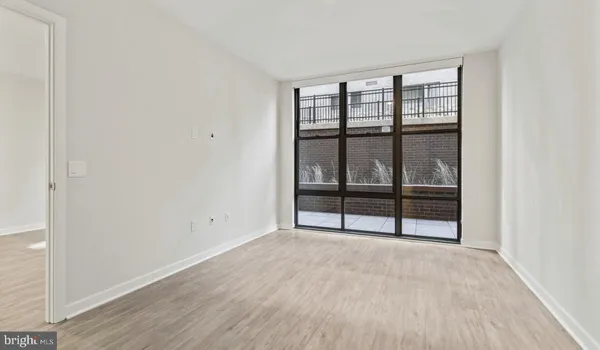 a kitchen with stainless steel appliances kitchen island a white stove top oven and sink