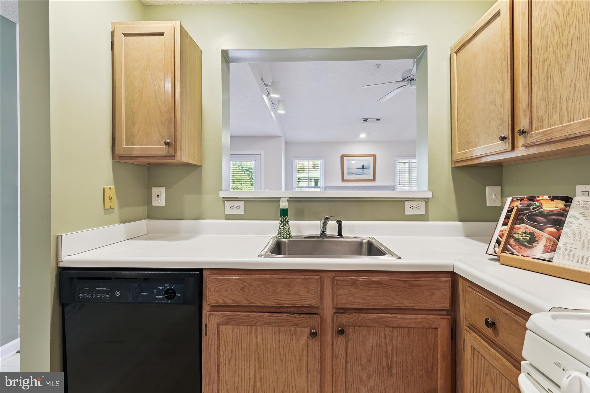 12005 Taliesin Place, Unit 35 Reston, VA 20190 - Photo 12 of 39 a kitchen with a sink and cabinets