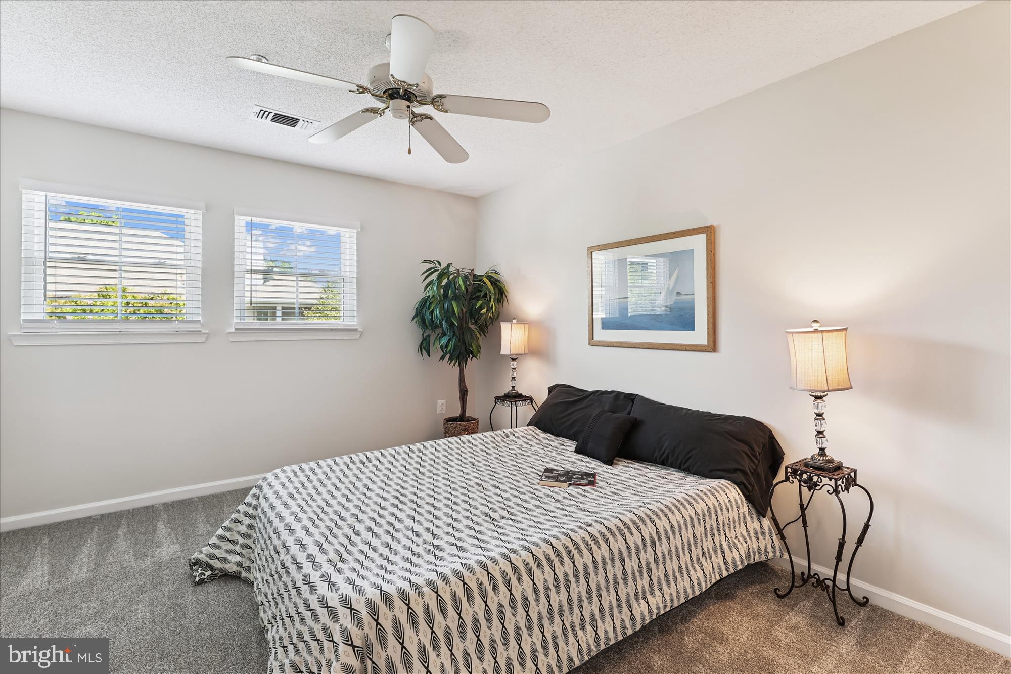 12005 Taliesin Place, Unit 35 Reston, VA 20190 - Photo 15 of 39 a bedroom with bed and a night stand