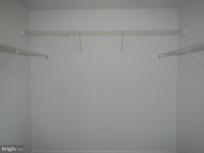 12005 Taliesin Place, Unit 35 Reston, VA 20190 - Photo 19 of 39 a view of a room with racks on the wall