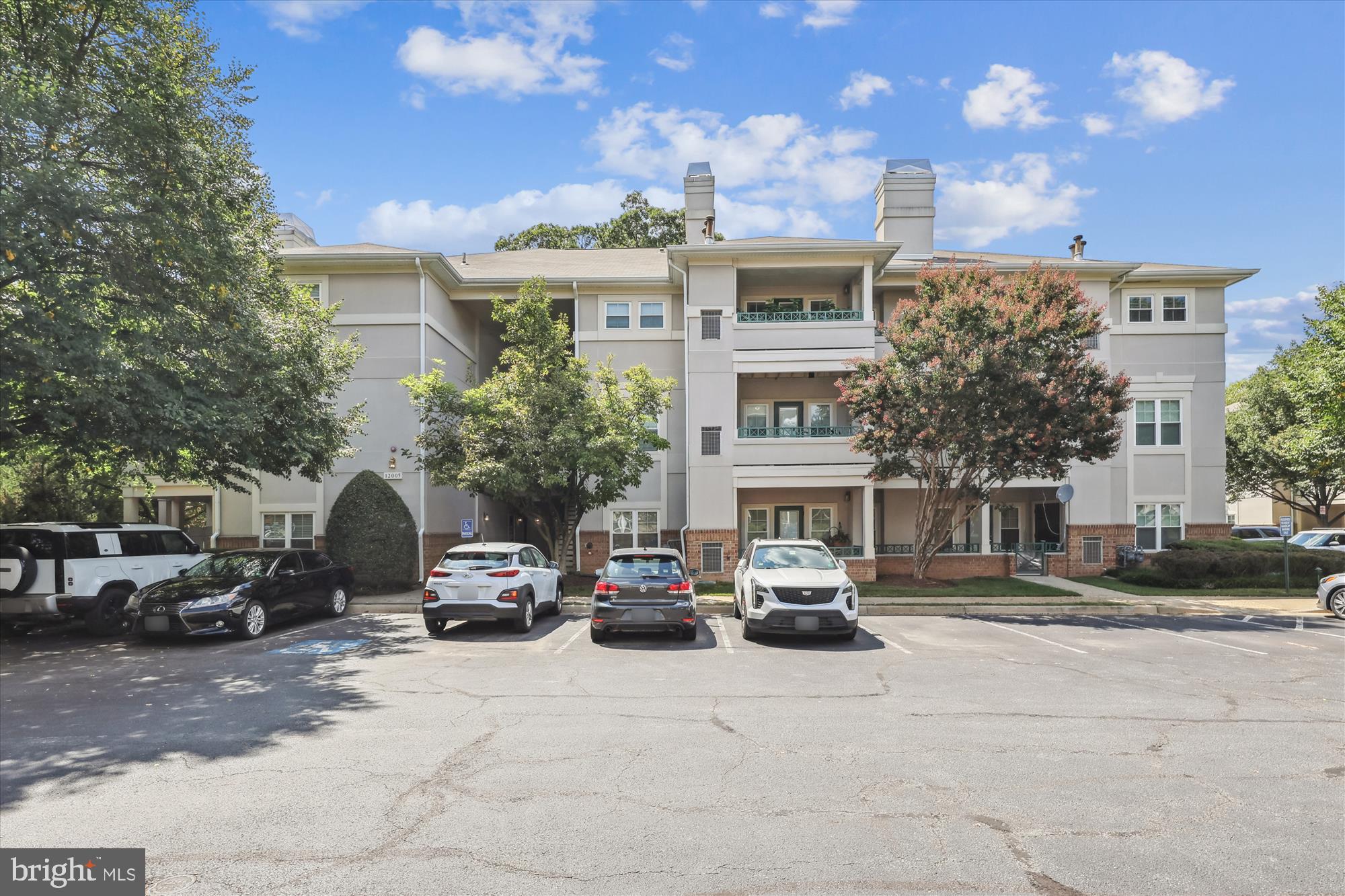 12005 Taliesin Place, Unit 35 Reston, VA 20190 - Photo 23 of 39 a car parked in front of the building