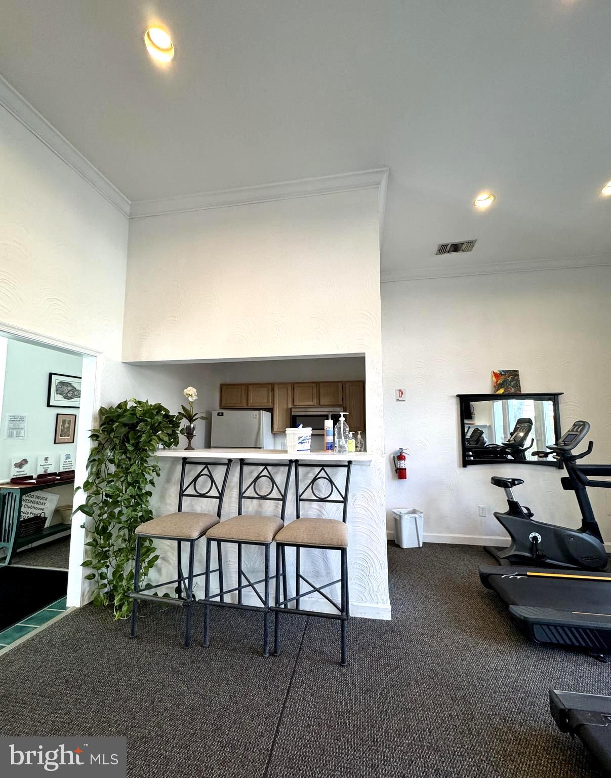12005 Taliesin Place, Unit 35 Reston, VA 20190 - Photo 25 of 39 a living room with furniture and a flat screen tv