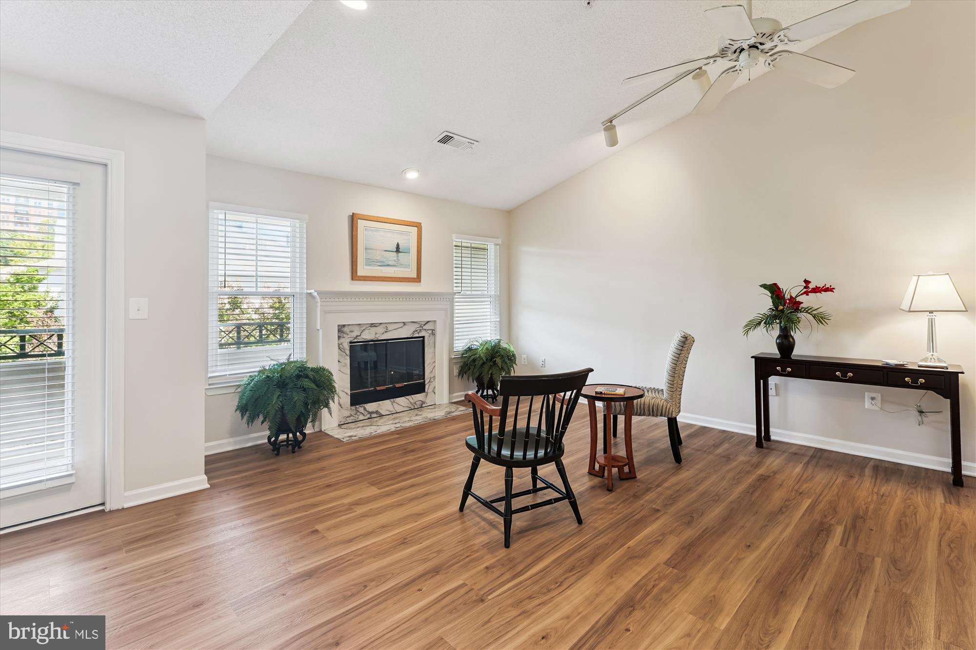 12005 Taliesin Place, Unit 35 Reston, VA 20190 - Photo 3 of 39 a living room with furniture and a fireplace