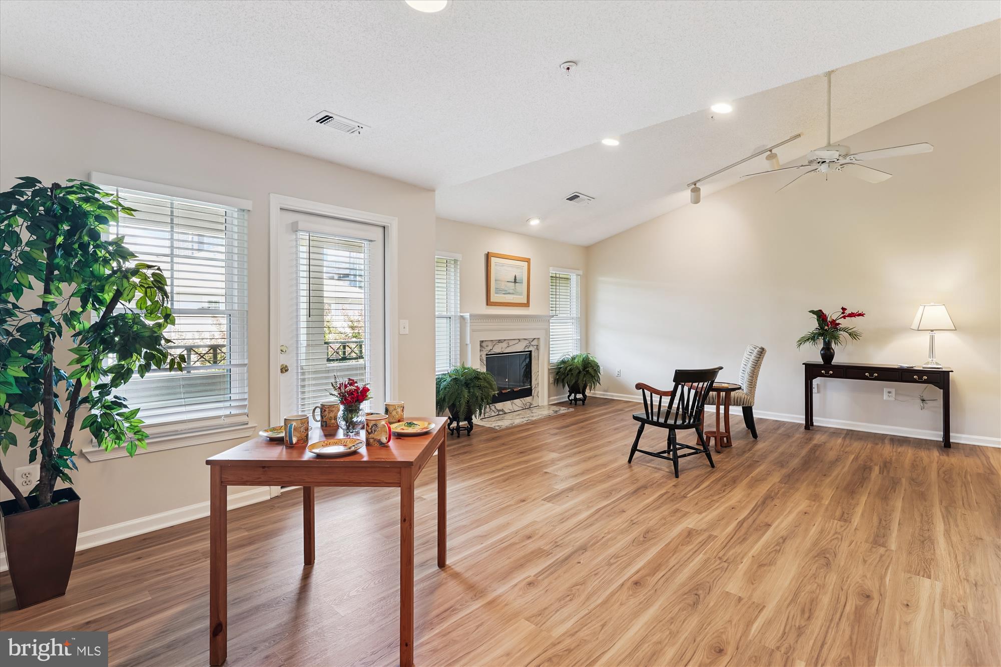 12005 Taliesin Place, Unit 35 Reston, VA 20190 - Photo 4 of 39 a living room with furniture and a wooden floor