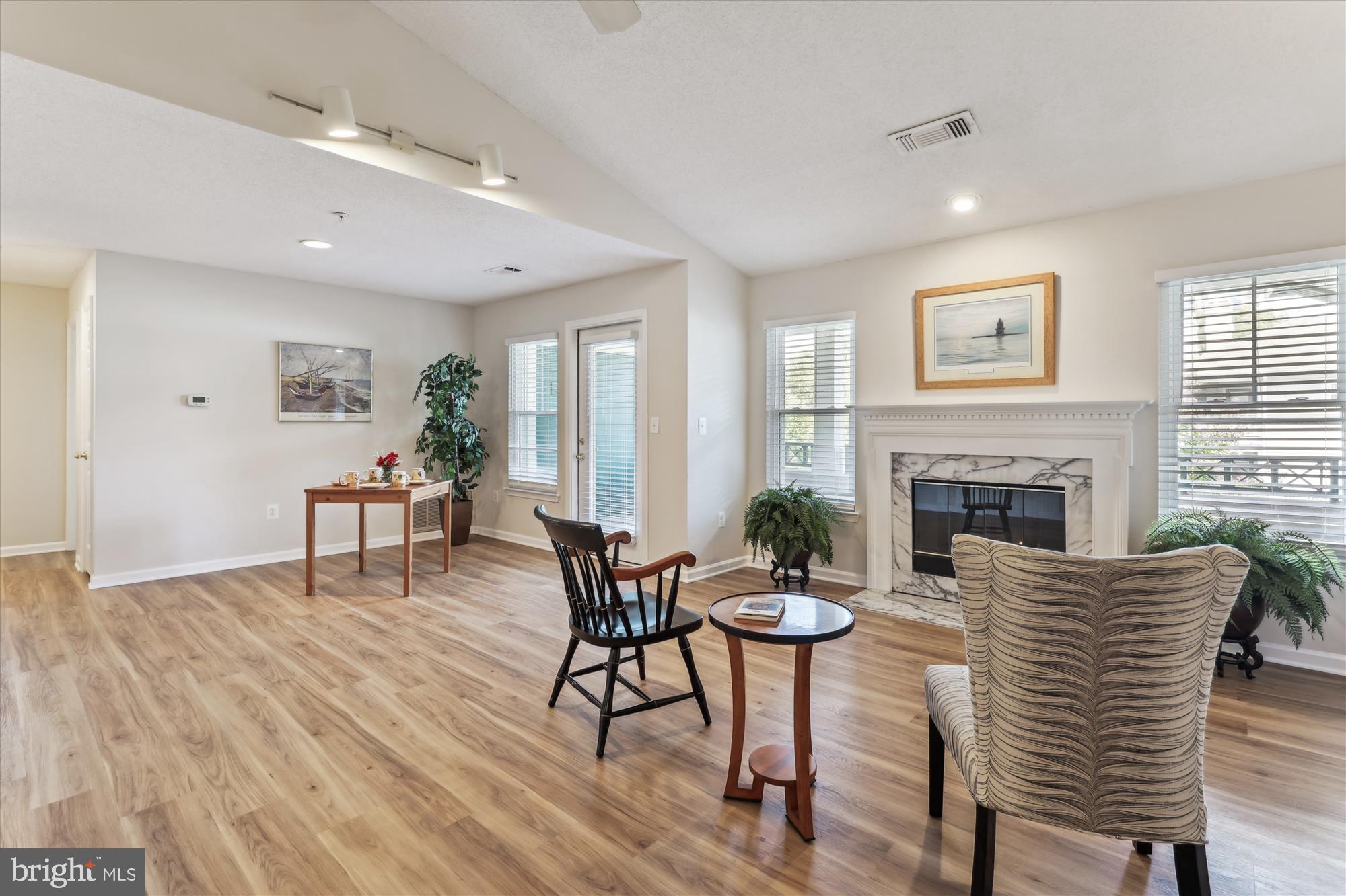 12005 Taliesin Place, Unit 35 Reston, VA 20190 - Photo 5 of 39 a living room with furniture and a fireplace