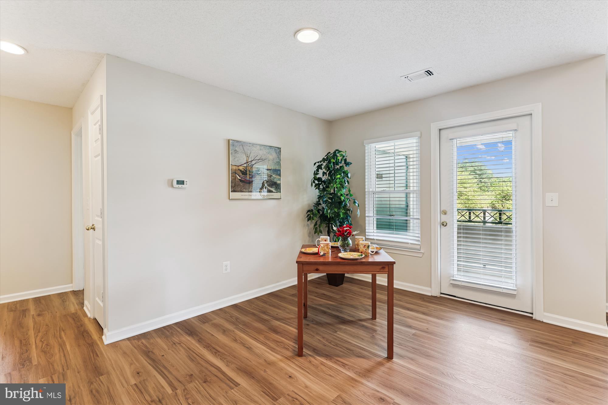 12005 Taliesin Place, Unit 35 Reston, VA 20190 - Photo 6 of 39 a living room with furniture and a window